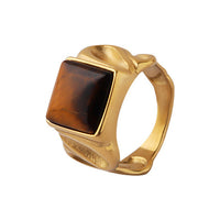 The WOO Eye Line tiger-eye ring in gold on a pure white background