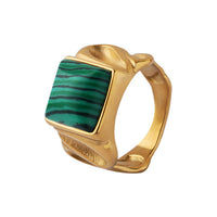 The WOO Eye Line green stone ring in gold on a pure white background