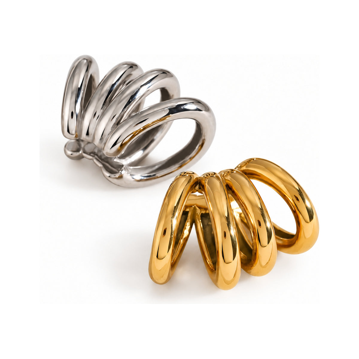The WOO Parallel Cut gold and silver earrings on a pure white background
