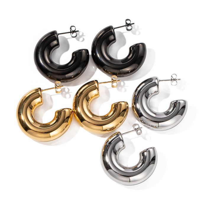 The WOO Crescent Earrings in gold, front view